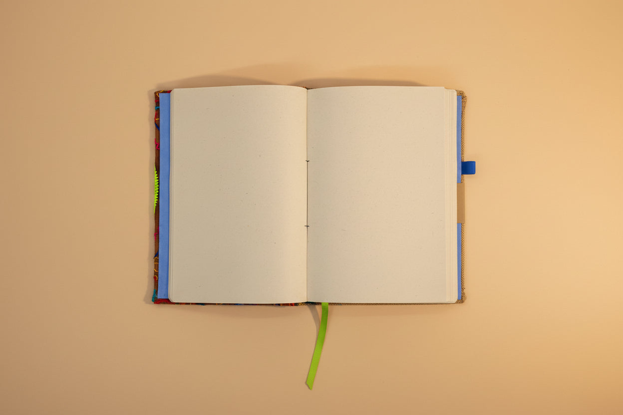 Open notebook with colorful binding on a white background