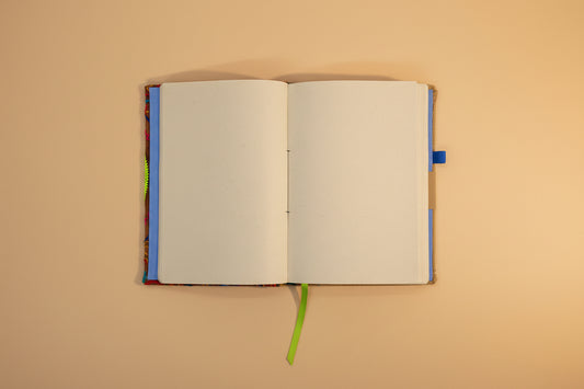 Open notebook with colorful binding on a white background