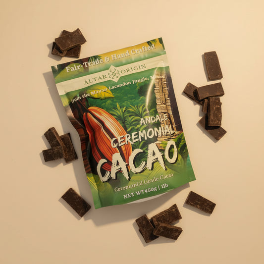 Cacao ceremonial chocolate packaging with pieces of dark chocolate on a white surface