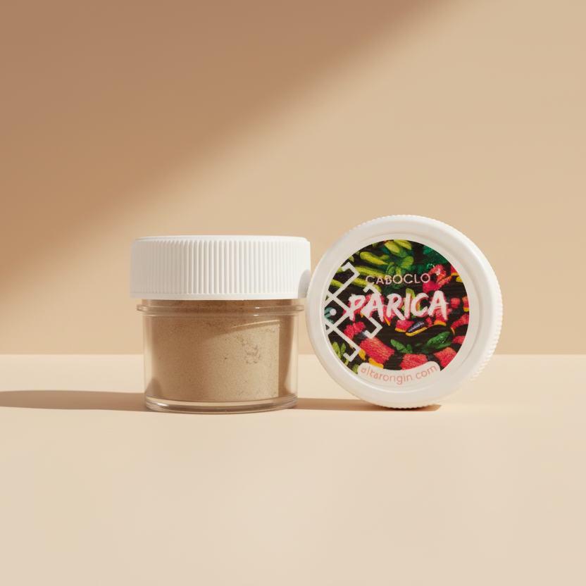 A small, sealed container with a white lid, labeled 'Caboclo Parica' next to an open container showing a fine, brown powder inside.